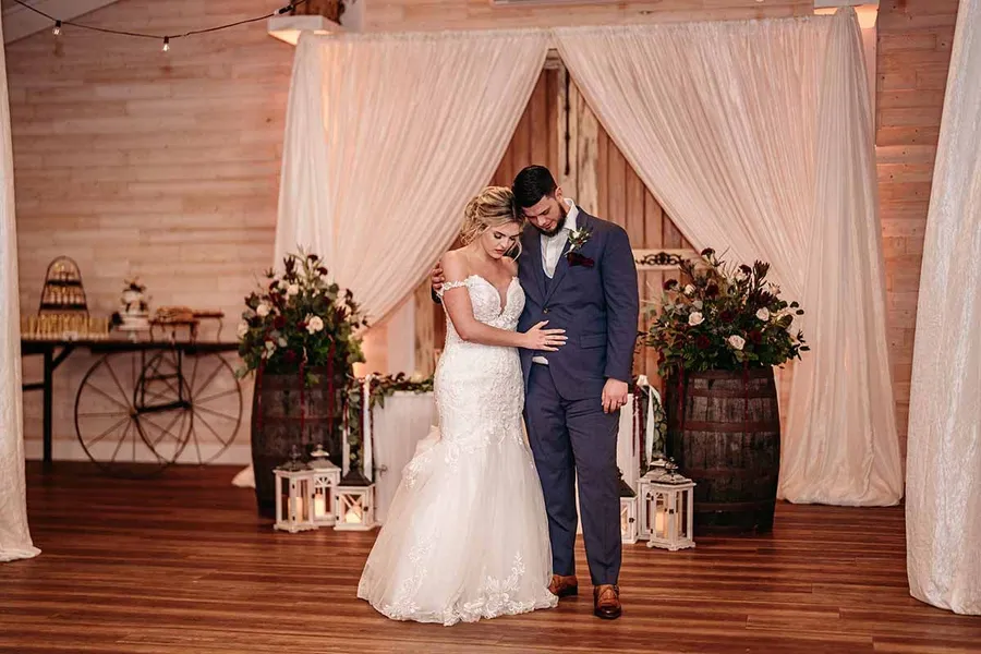 Savanah and Noah inside the Legacy Barn