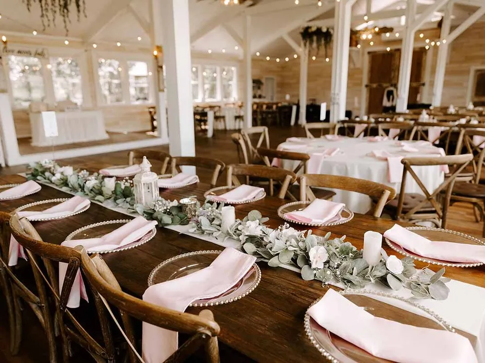 Tables set inside the Legacy Barn
