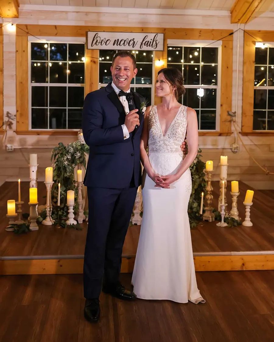 A couple giving a toast in the Legacy Barn
