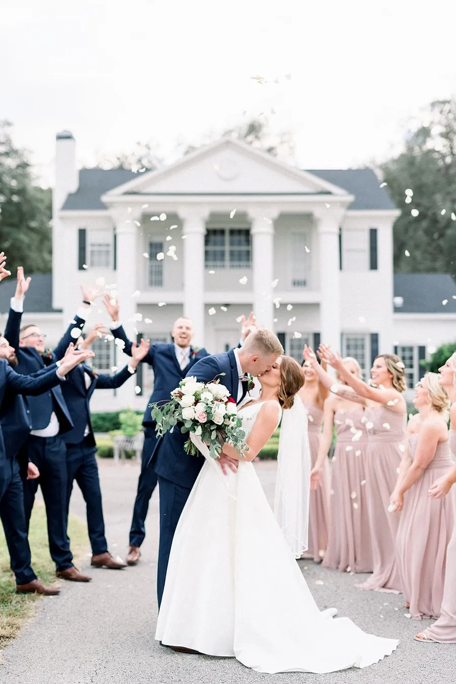 A wedding party tossing petals
