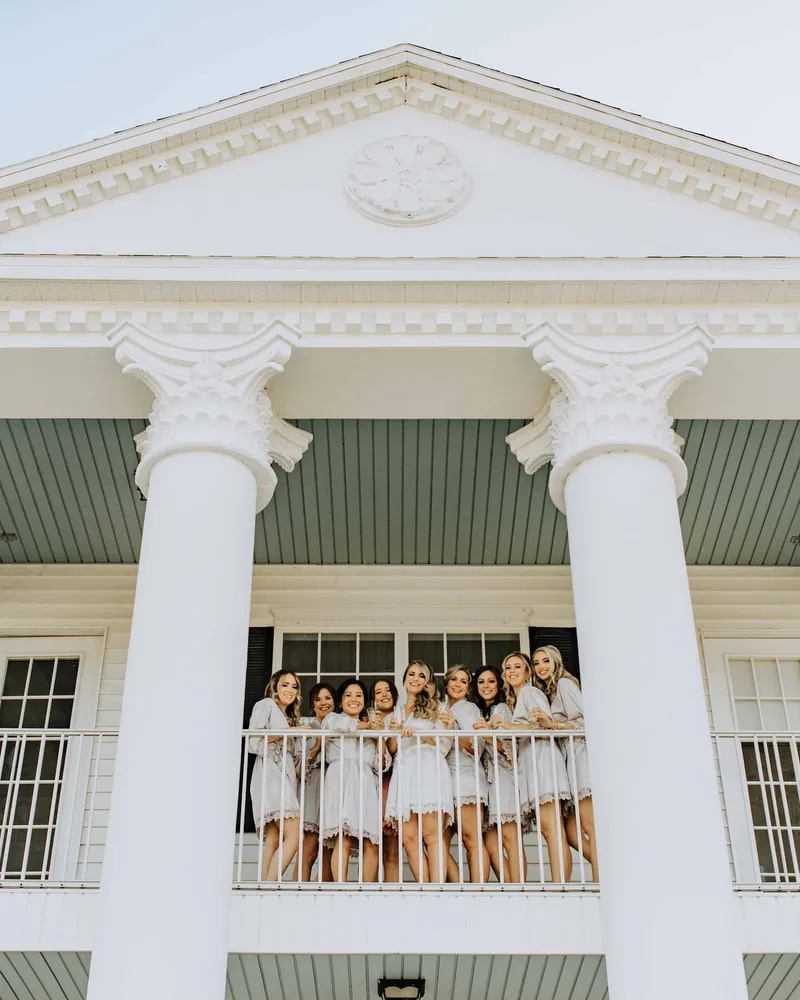 A bridal party on the porch of the Bridal Estate