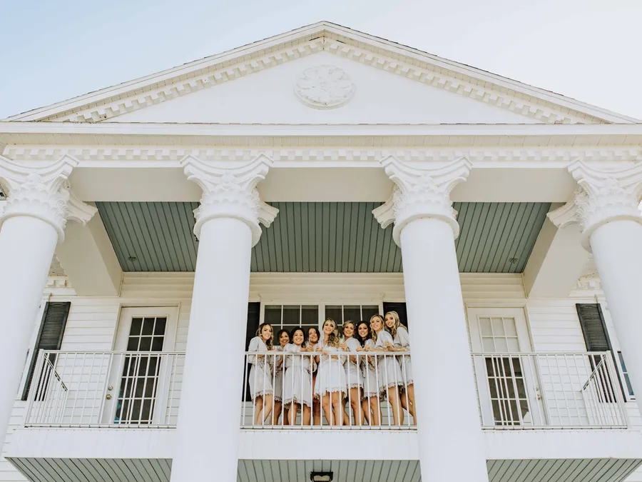 A bridal party on the porch of the Bridal Estate