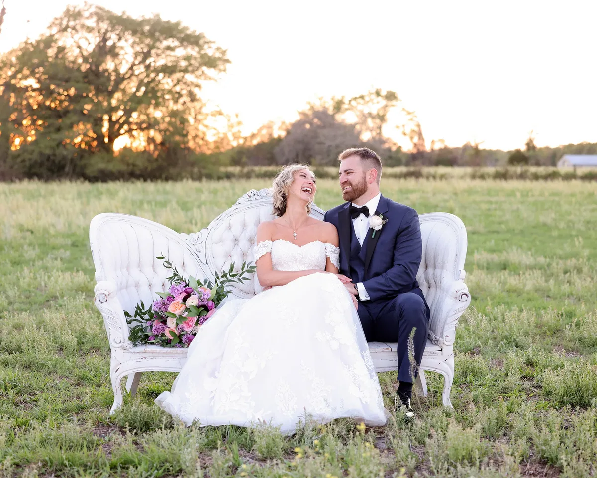 A couple on a settee in the field